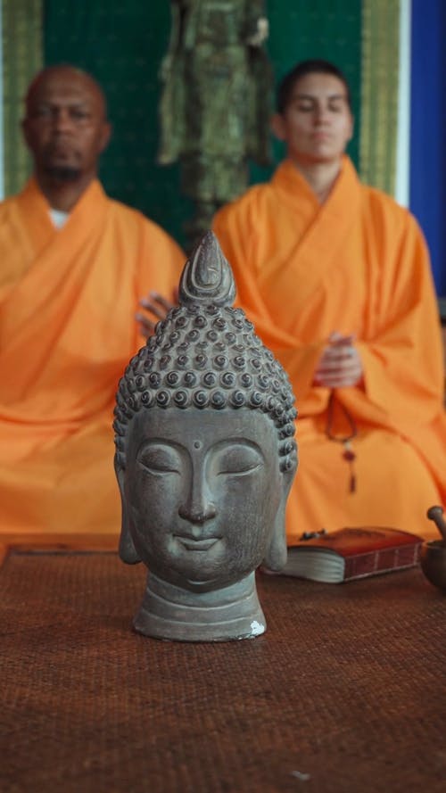 A Footage of Head Buddha Figurine on a Table