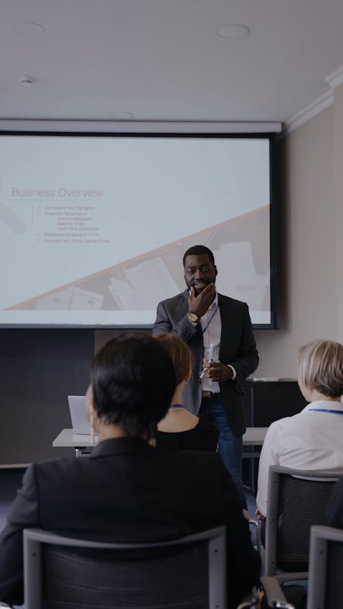 A Man Presenting in Front of People