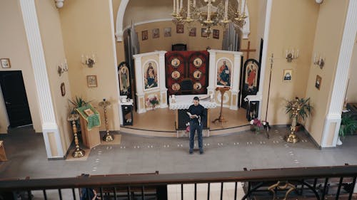 A Man Standing on the Altar