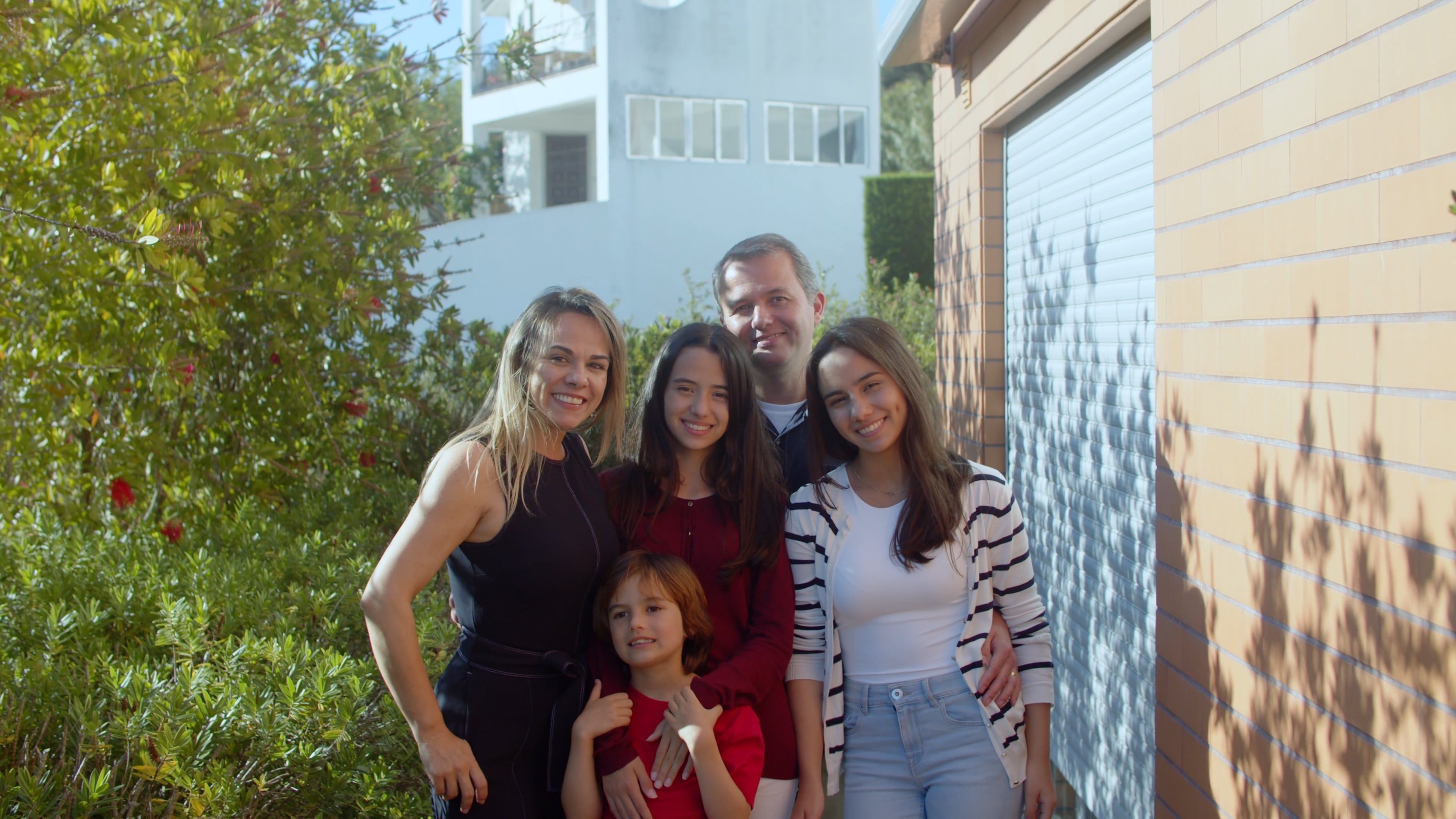 Family Posing Outside a House · Free Stock Video