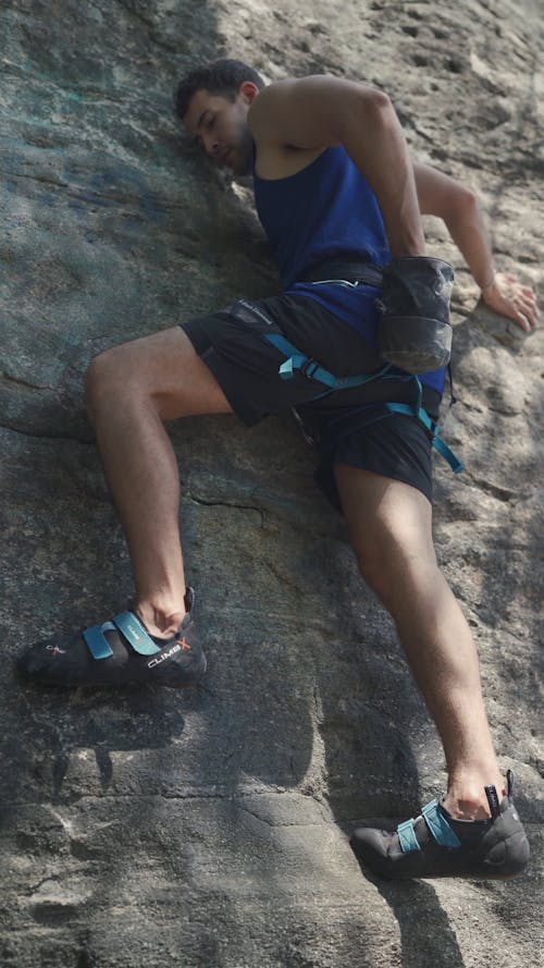 Person Rock Climbing