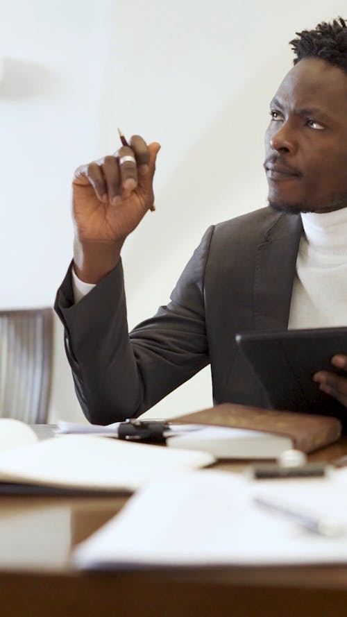 A Businessman Working and in Deep Thought