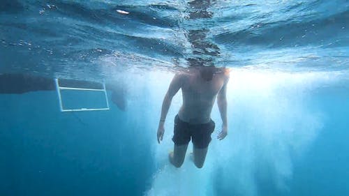 A Shirtless Man Snorkeling