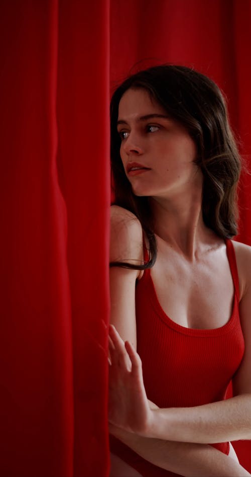 A Woman Wearing Red Bodysuit