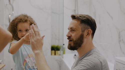 A Man Talking to His Kids