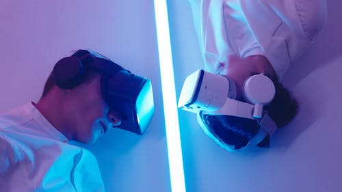 Man and Woman Wearing VR Goggles
