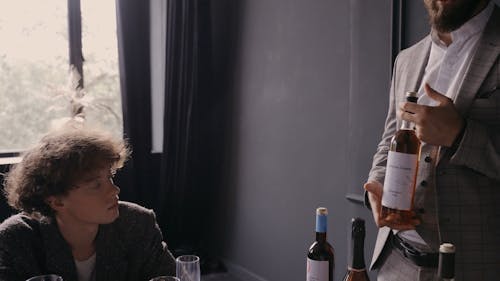 A Man Listening to the Sommelier