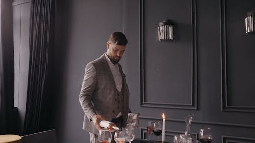 Man Pouring Wine in a Wine Glass