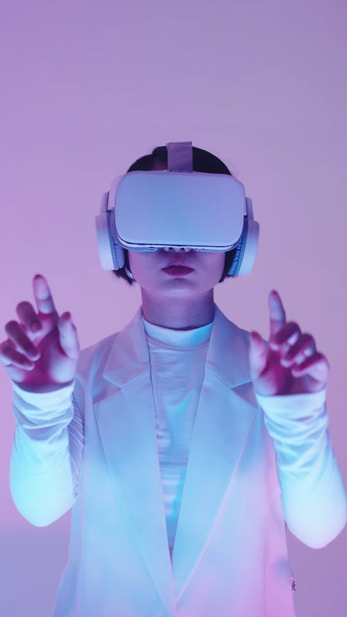 A Woman Wearing a VR Headset and Headphones