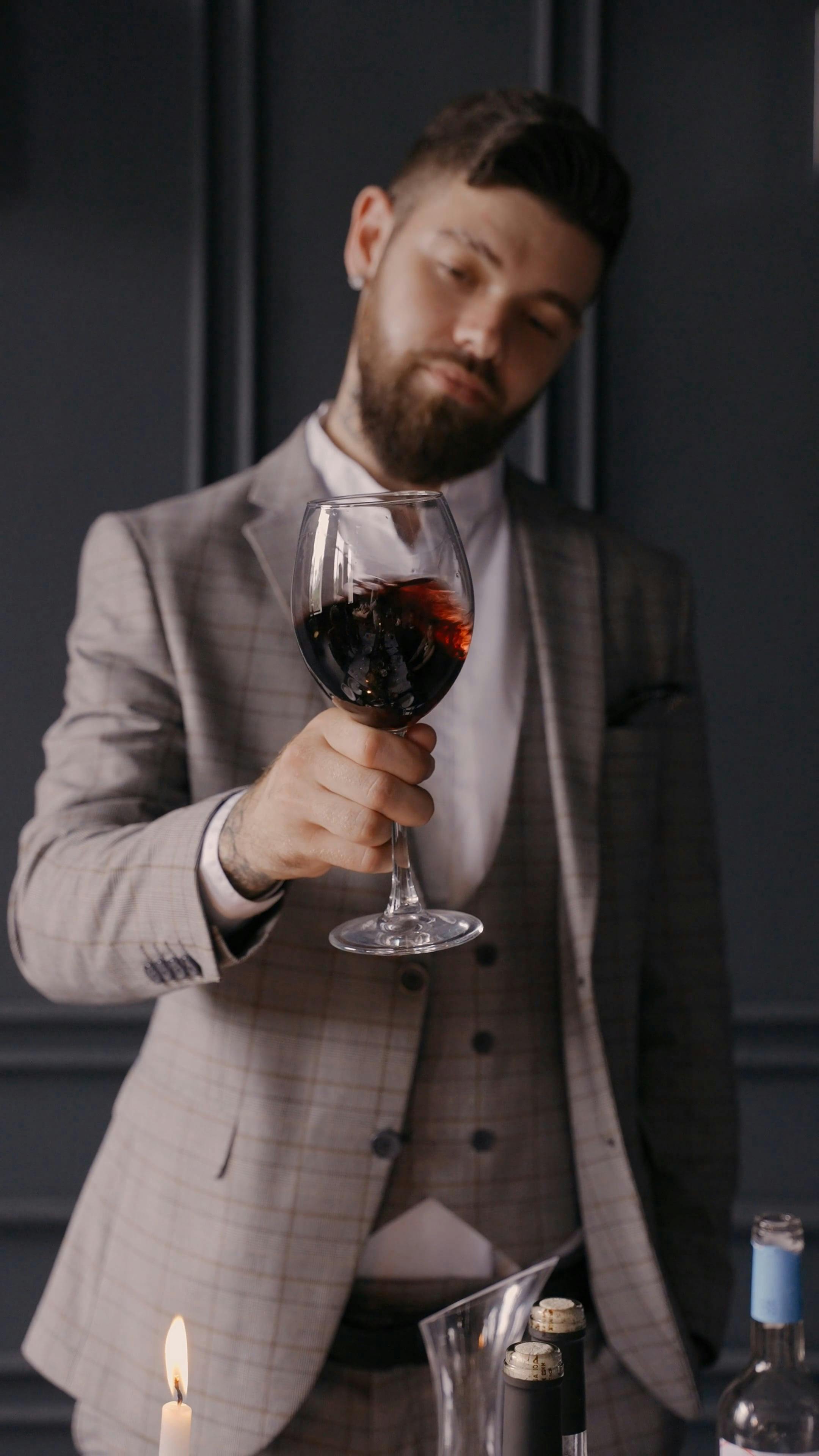 Man Swirling a Glass of Red Wine \u00b7 Free Stock Video