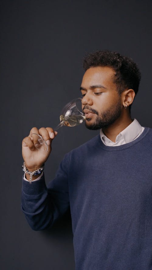 Man with Facial Hair Drinking Wine