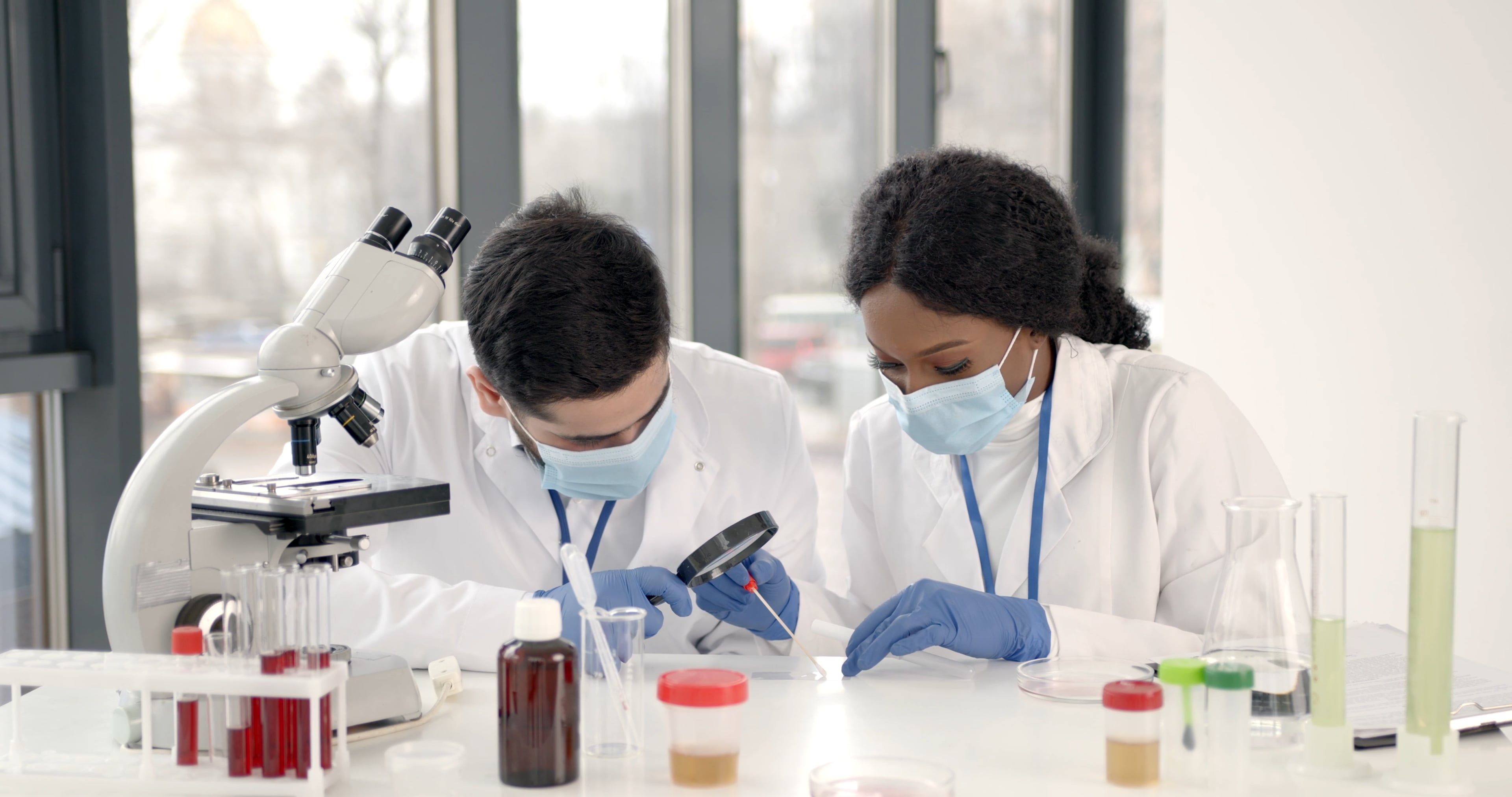 Man and Woman Doing Experiment in the Laboratory Free Stock Video ...