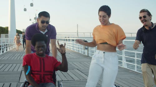 Friends Having Fun in the Harbor Boardwalk