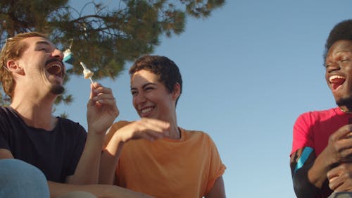 People Eating Ice Cream While Having Conversation