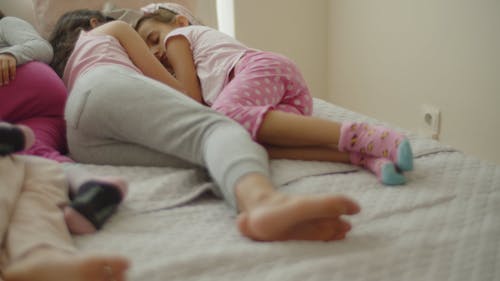 Kids Sleeping on a Bed 