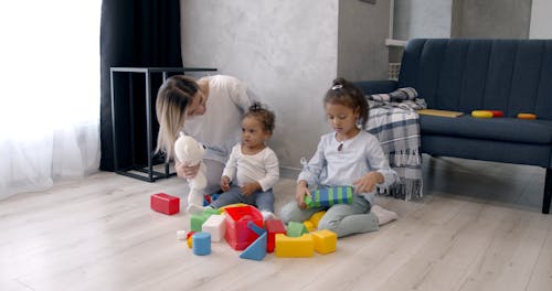 Woman Playing Toys With Her Children