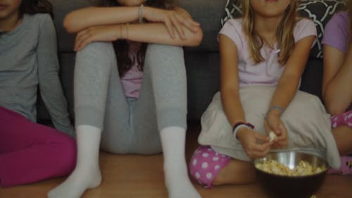 Kids Eating Popcorn While Watching