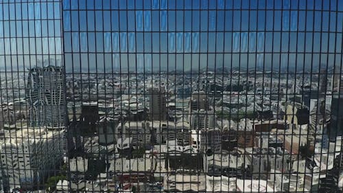 Aerial Footage of a Modern Glass Building