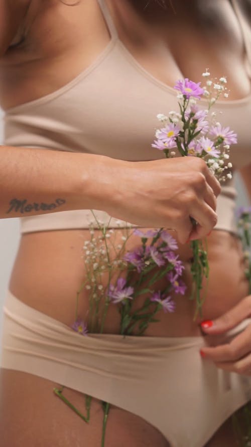 A Person Putting Flowers in Underwear