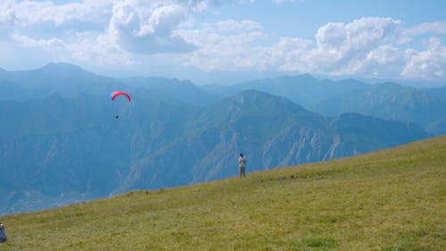 Person Riding Parachute 