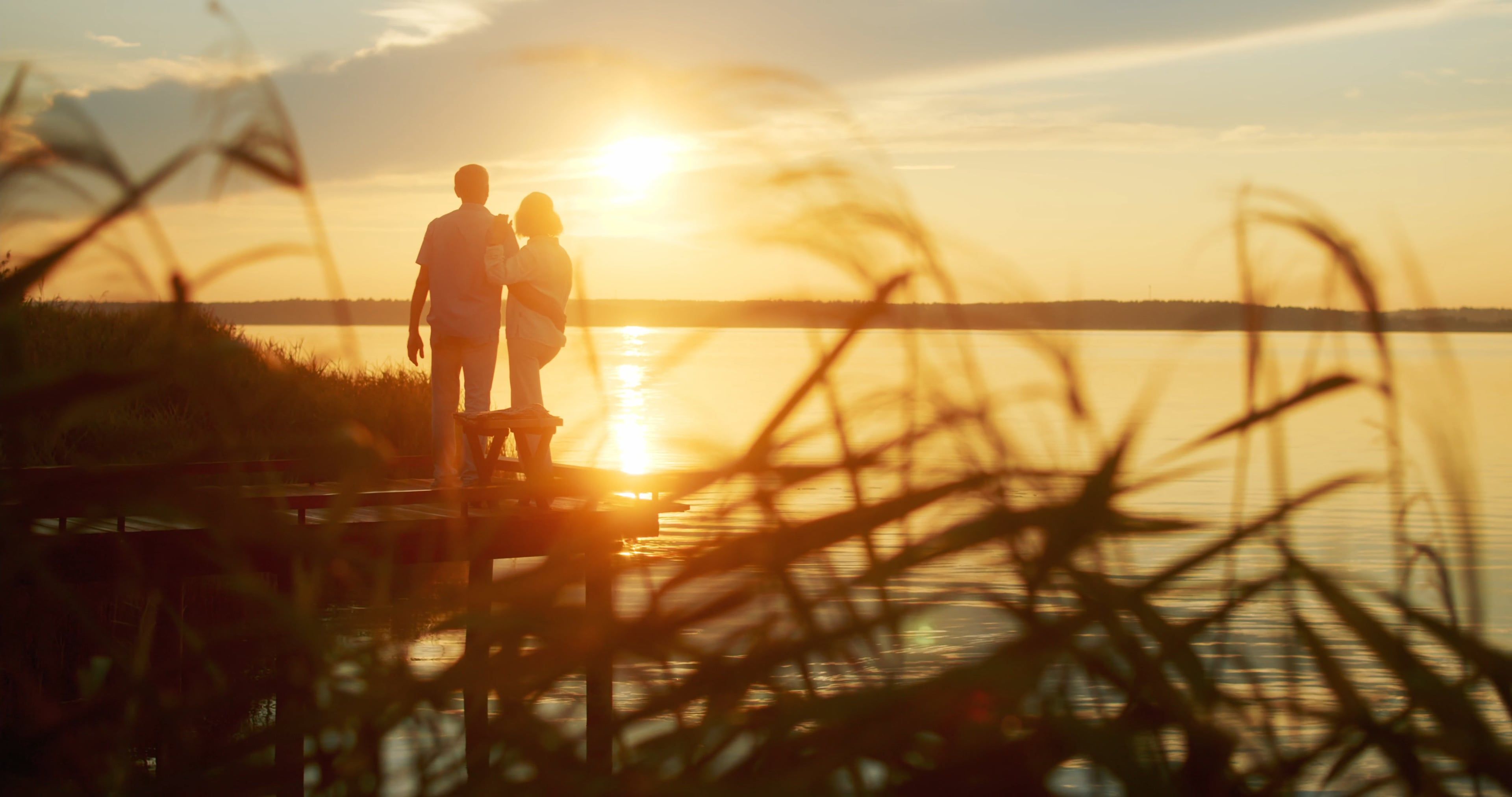 A Couple on a Pier Watching the Sunset Free Stock Video Footage ...