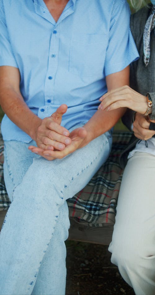 An Elderly Couple Holding Hands