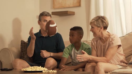 Family Watching a Football Game at Home