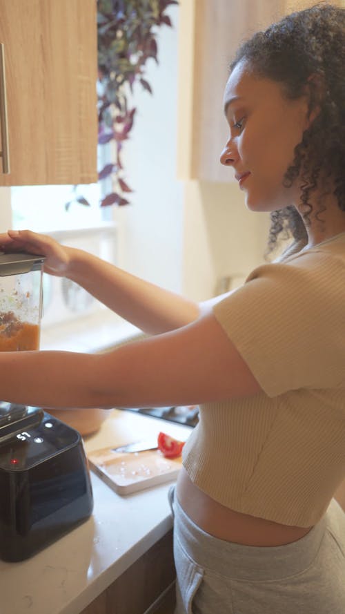 Woman Using a Blender