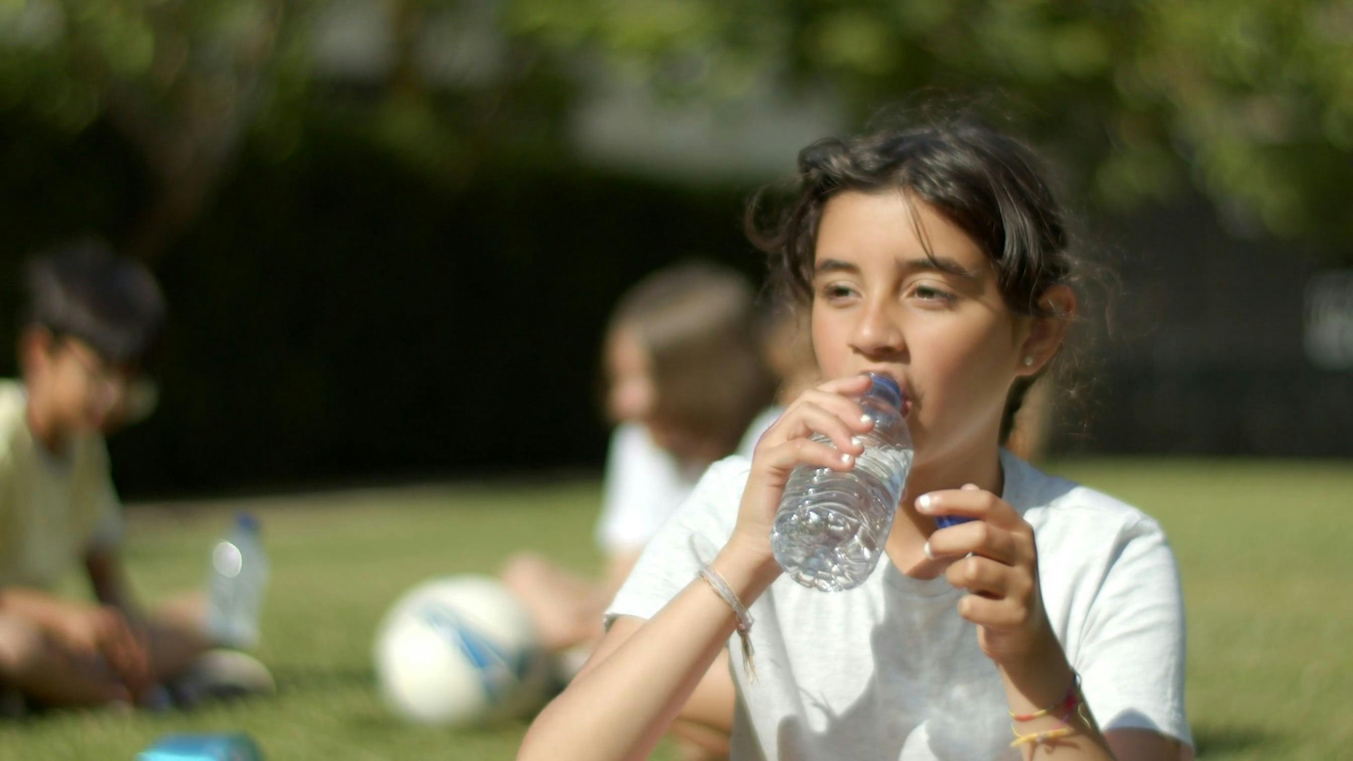 A Girl Drinking Bottled Water · Free Stock Video