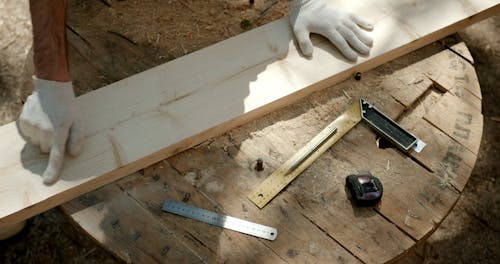 Carpenters Polishing the Wooden Plank