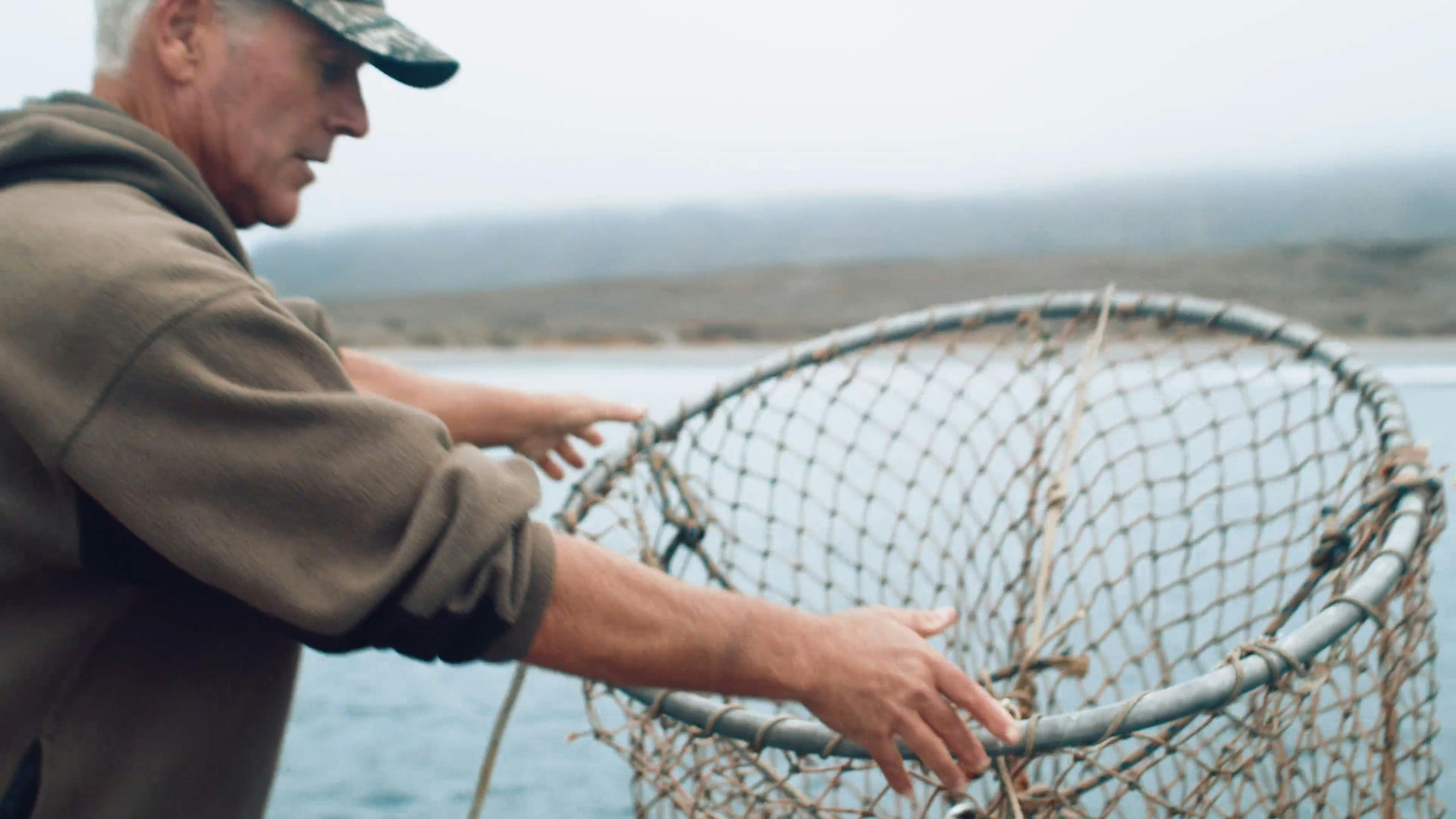 Man Throw a Fishing Net in the Ocean · Free Stock Video