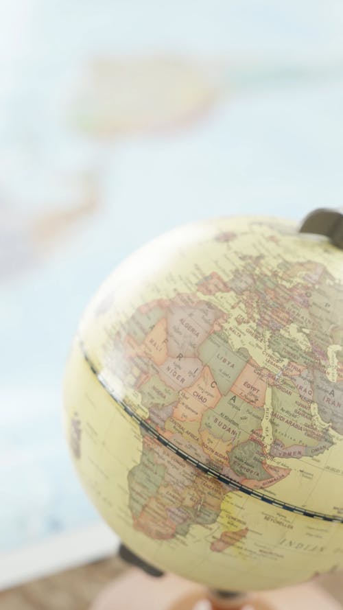 Close Up of a Globe and a Map