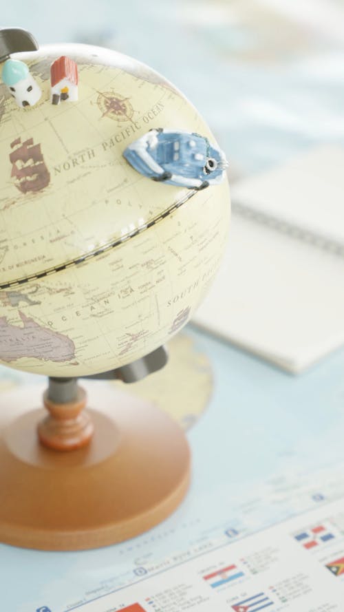 Miniature Items on a Globe
