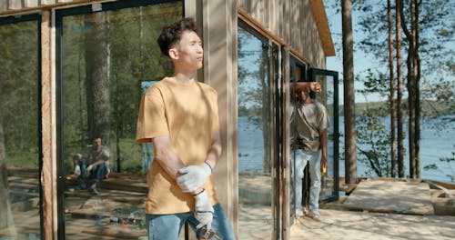 Men Workers Standing and Posing while Holding Tools