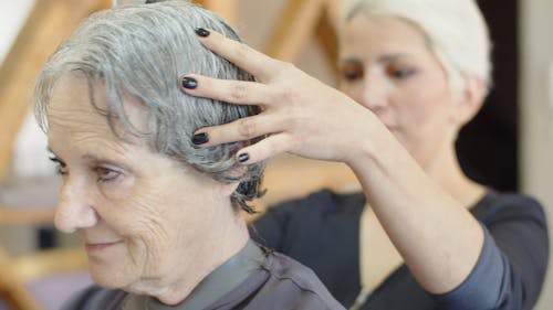Elderly Woman Having a Haircut