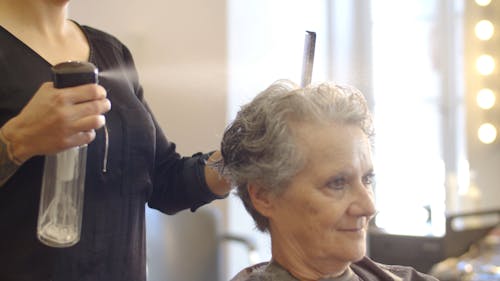 Elderly Woman Having Her Haircut