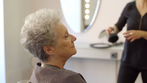 Elderly Woman Having Her Haircut