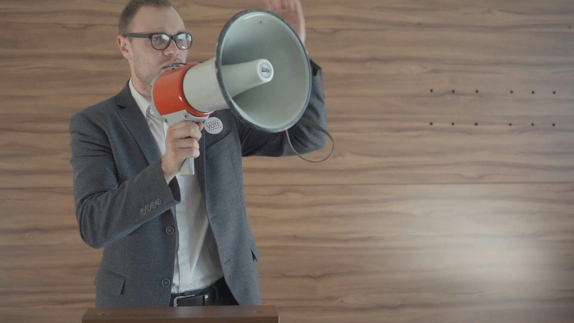 Political Candidate Speaking through Megaphone · Free Stock Video