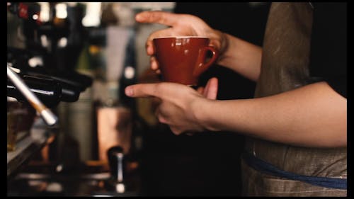 A Person Holding a Cup of Coffee
