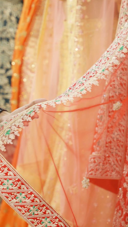 A Woman Checking the Dress Fabric