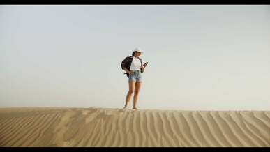 a woman trying to get a signal on her phone
