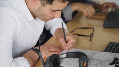 A Man Filling out a Form