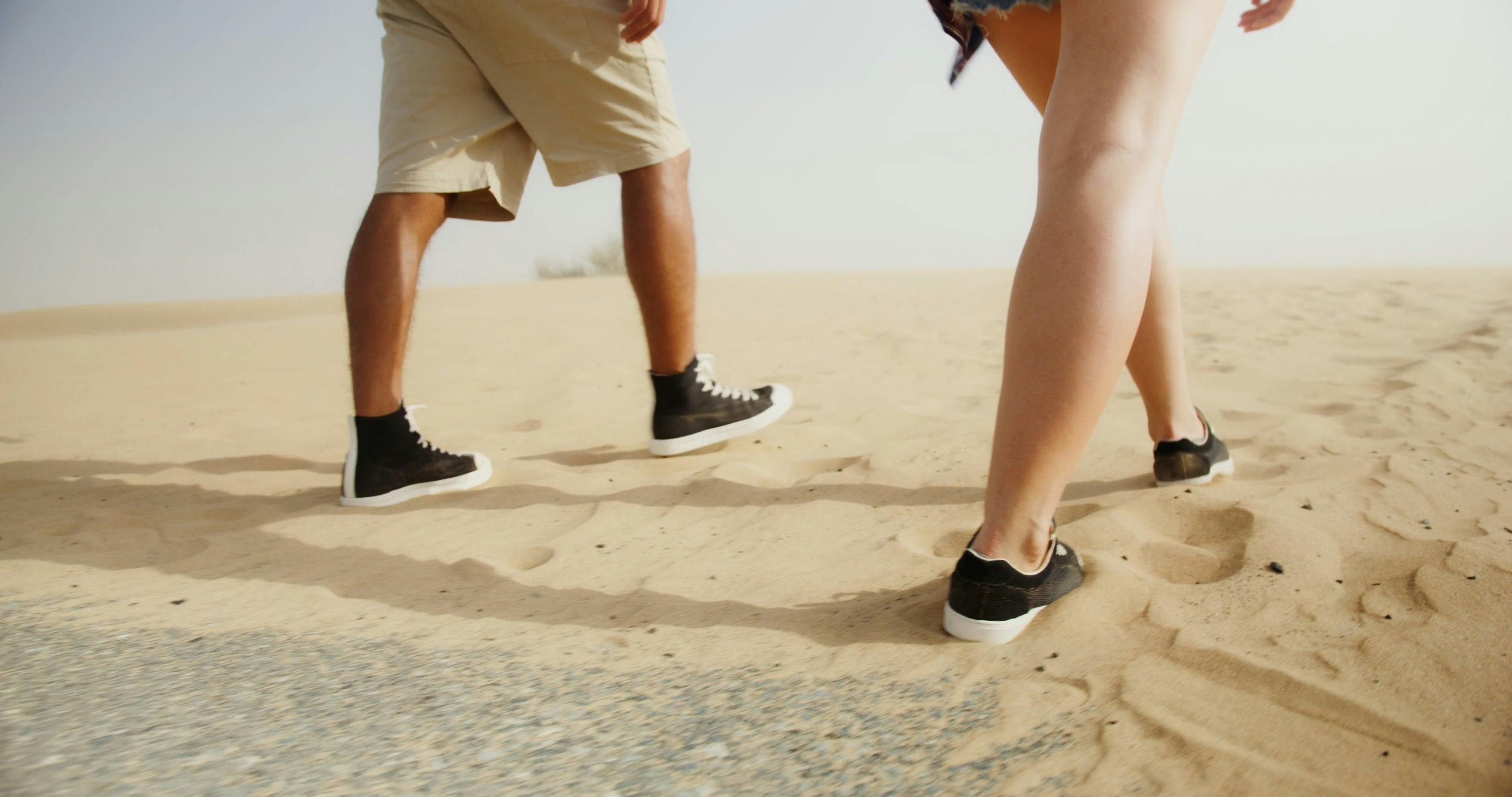 People Wearing Shoes while Walking on the Sand Free Stock Video Footage