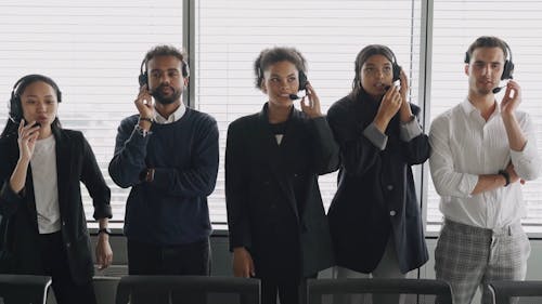 Call Center Agents Standing While Taking Calls