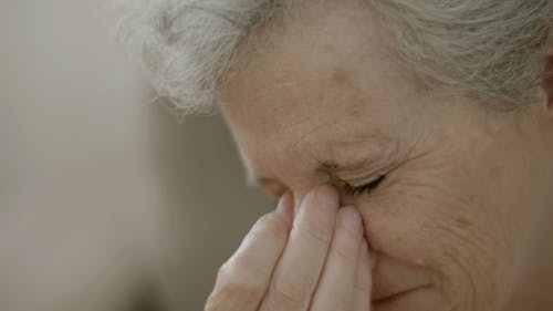 Close up Shot of a Sad Elderly Woman 