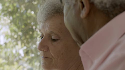 Elderly Man Comforting an Elderly Woman