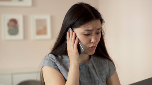 A Close Up of a Woman Talking on the Phone