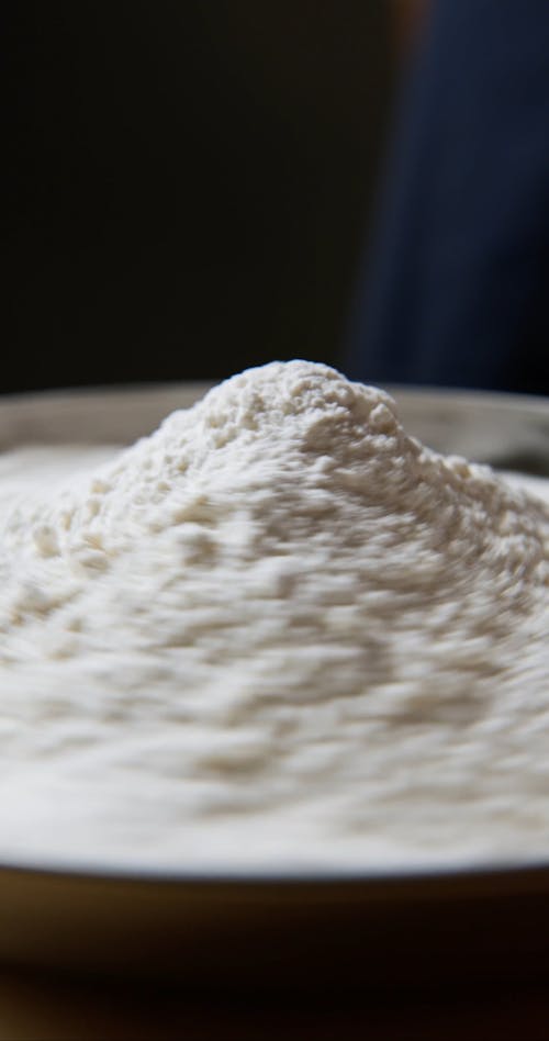 Egg Yolks And Flour In A Mixing Bowl