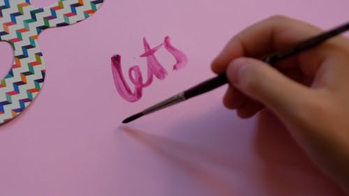 Person Doing Calligraphy Painting