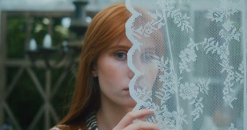 Close Up Shot of a Woman With Green Eyes Looking at Camera 